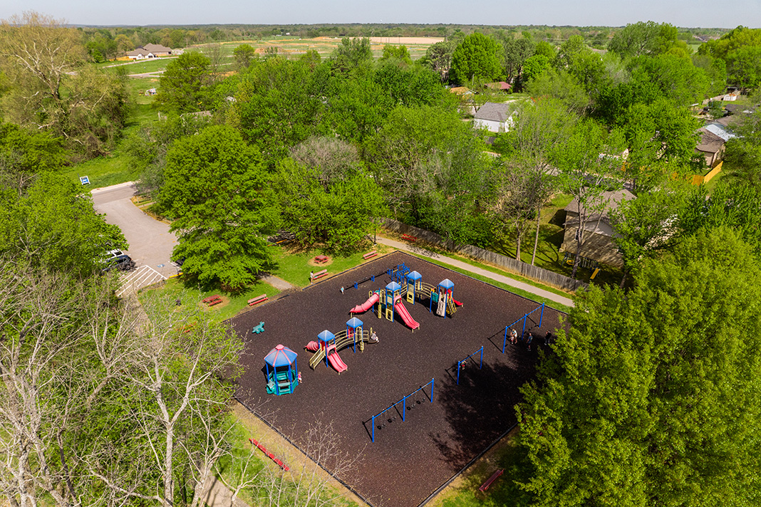 Aerial view of Farmington park featuring a large children playground