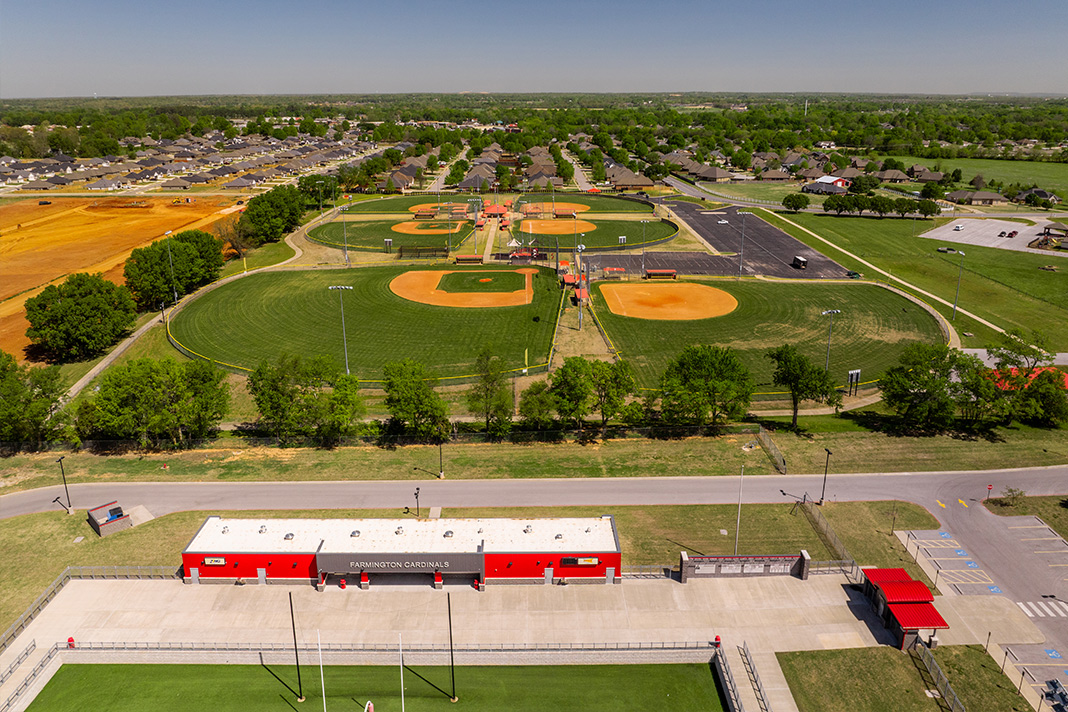  Aerial view of a Farmington sports complex with baseball courts, Farmington Cardinals building